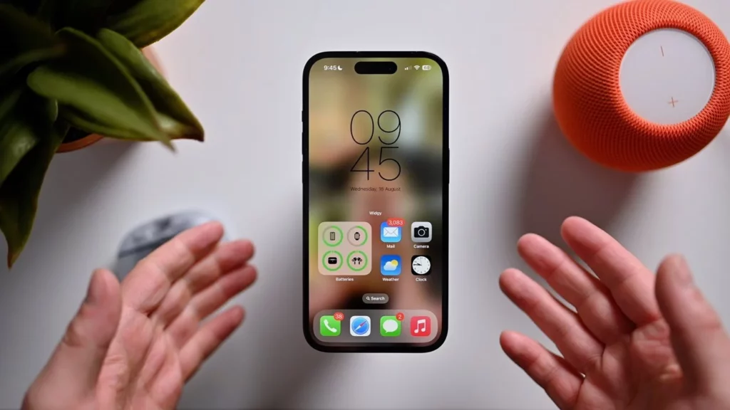 An iPhone between the hnads of a man; What Are iOS 17 Beta 6 Bugs & How to Fix Them